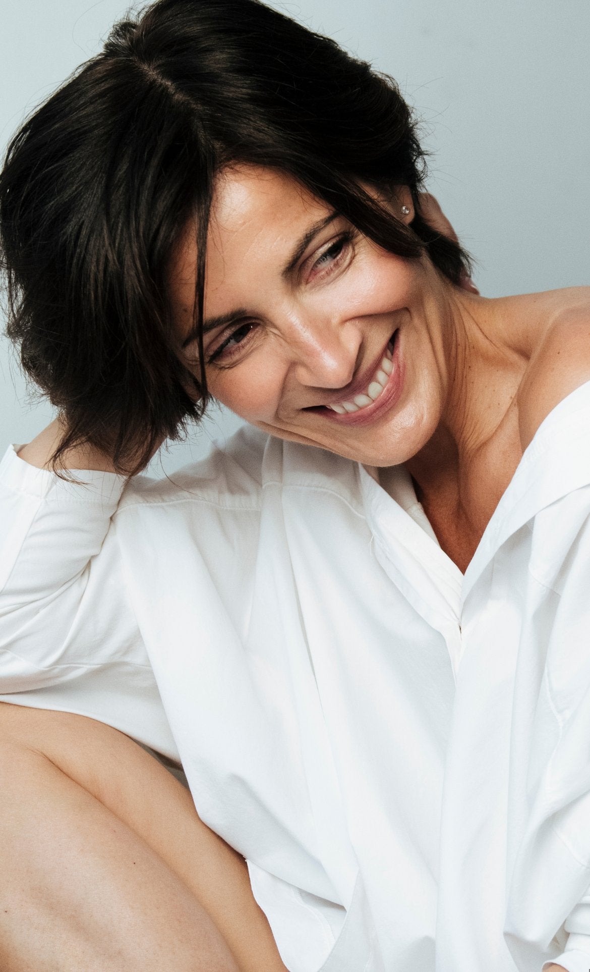 Smiling woman in a white shirt