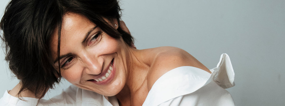 Smiling woman in a white shirt
