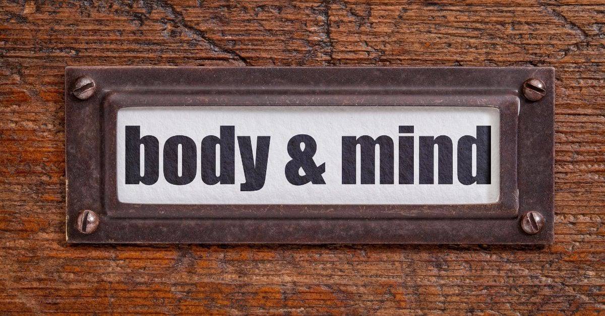 body and mind sign on wooden background