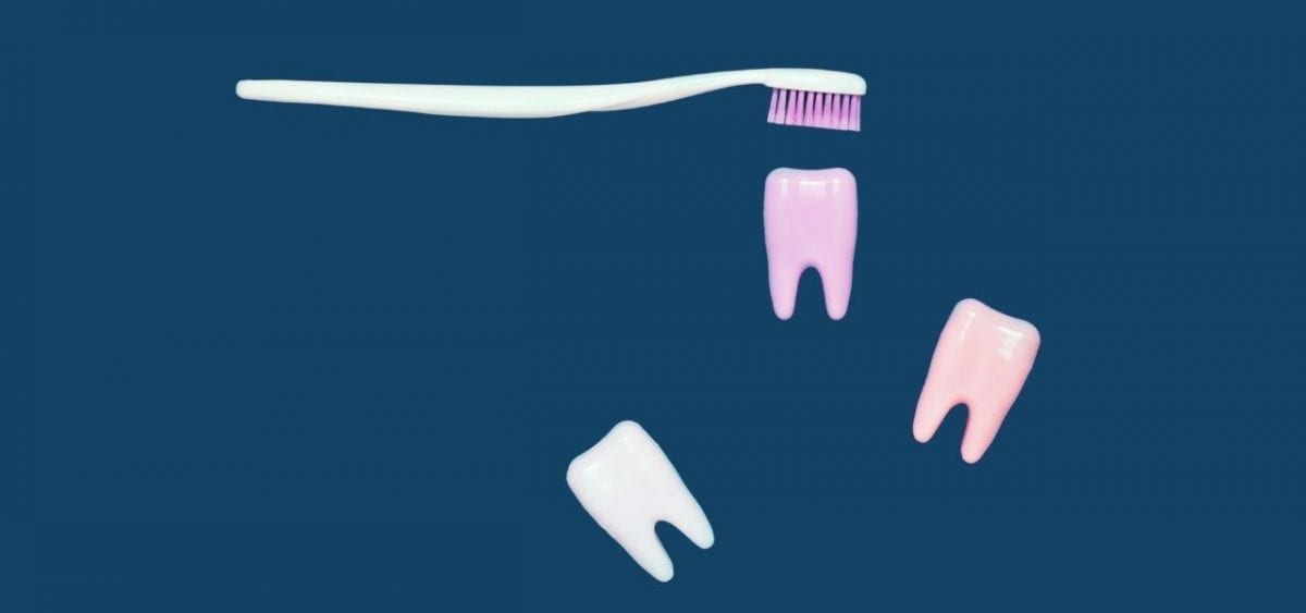 toothbrush and teeth on blue background