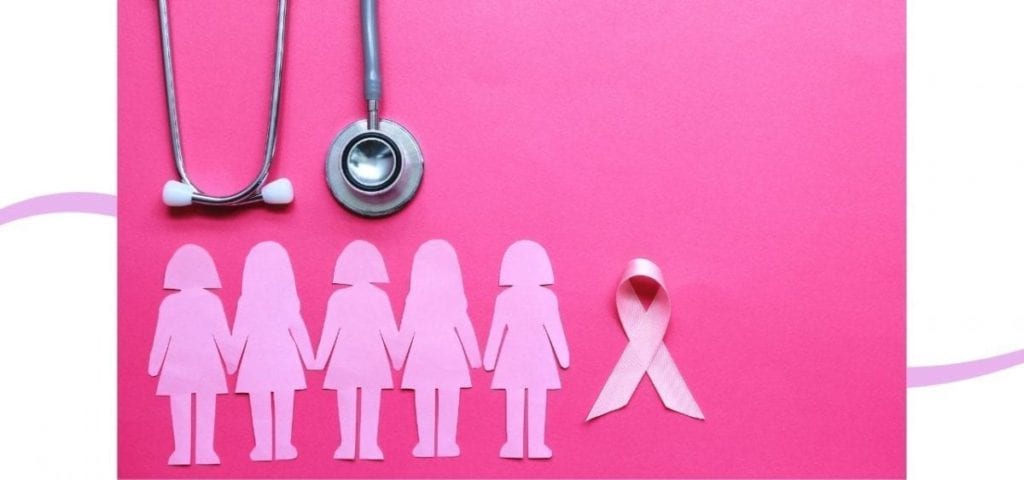 pink background with paper women and pink ribbon for breast cancer