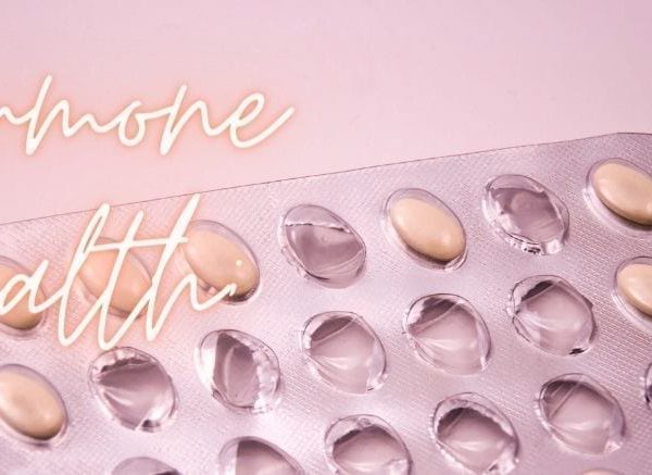 contraception pills on pink bakground