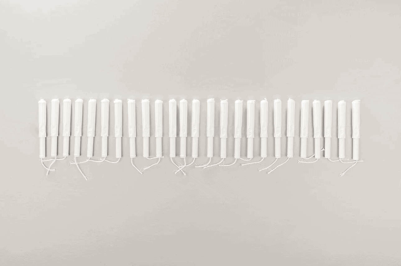tampons lined up on a neutral background