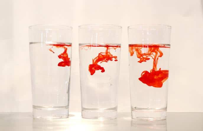 red drops in water glasses